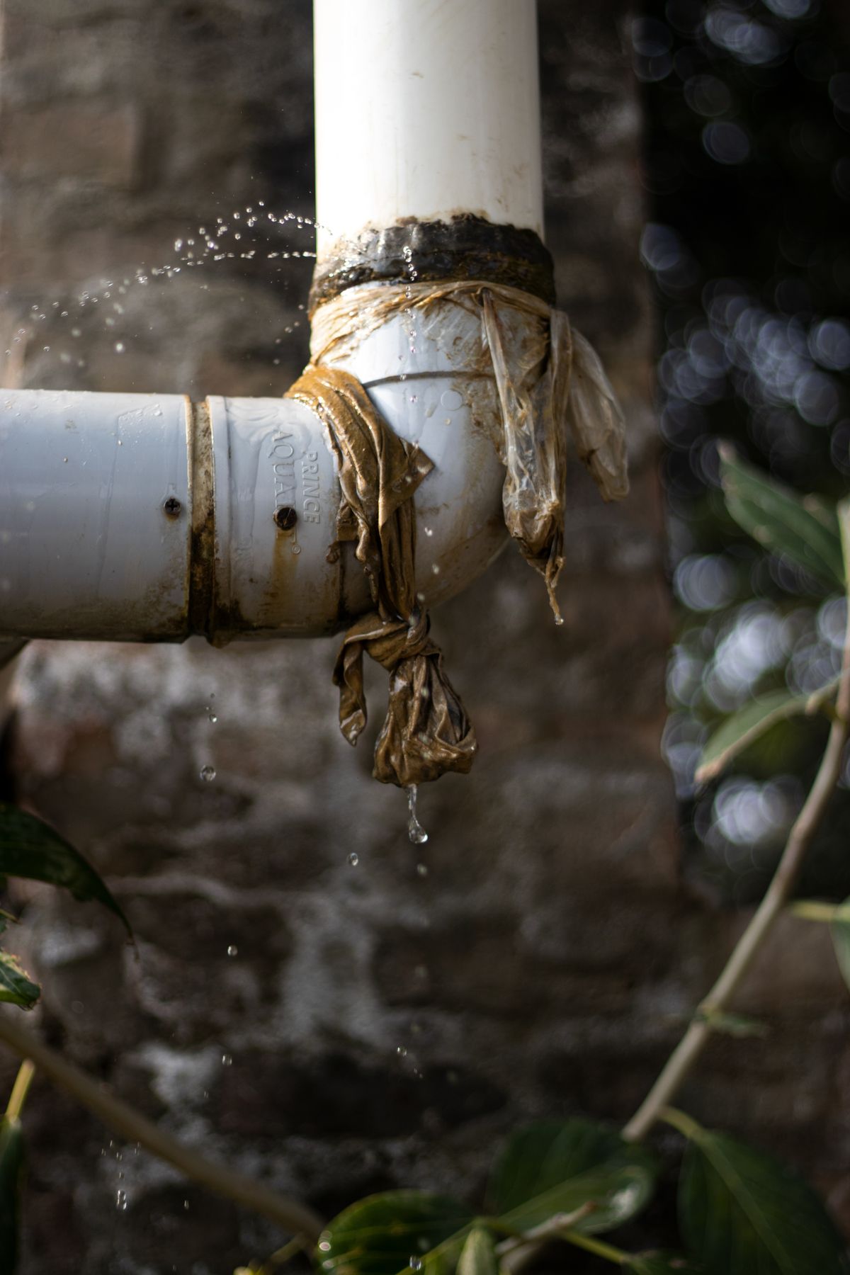 Reference photo of a leaking pipe, not this company's work